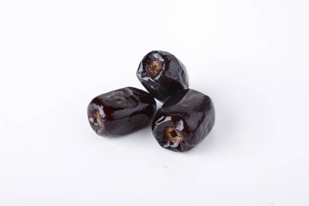 dates fruit over a white background