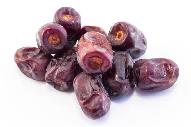 Ripe Dates Fruit Isolated on White.
